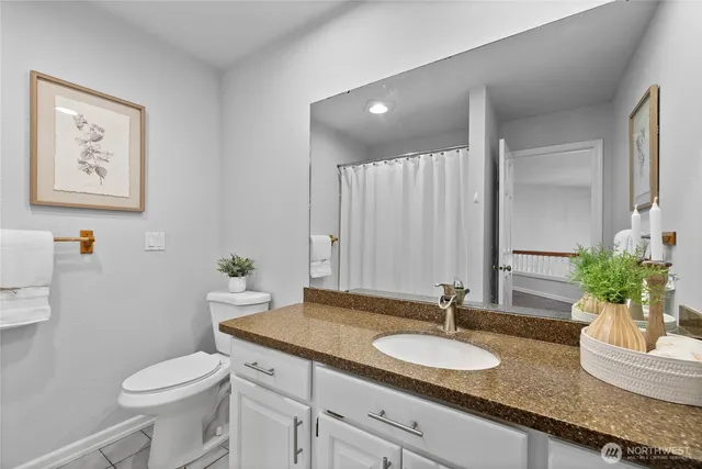 a spacious bedroom with a bed a table and a large window