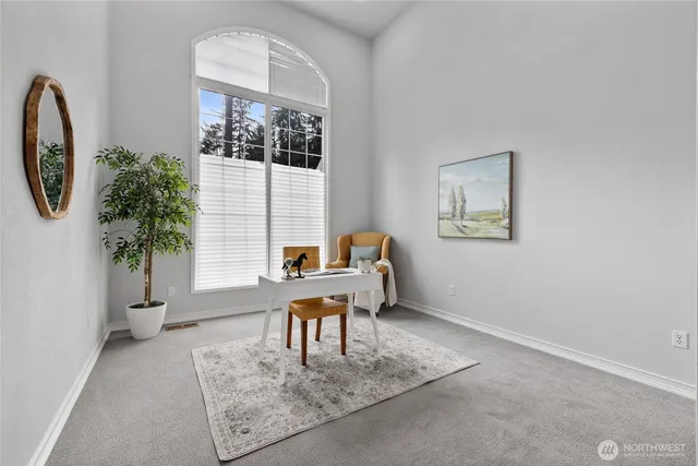 a workspace with furniture and a window