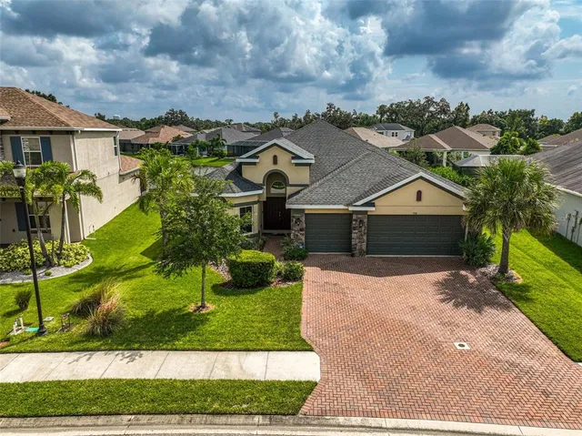 an aerial view of a house with a garden