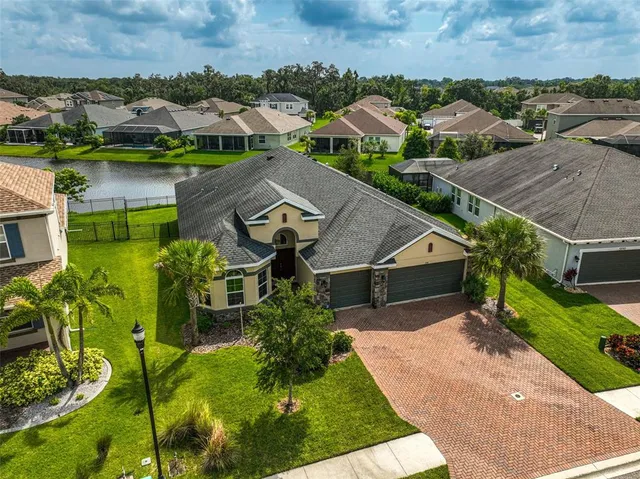 an aerial view of a house with a garden