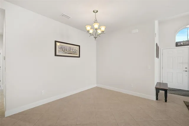 a view of a hallway with a chandelier
