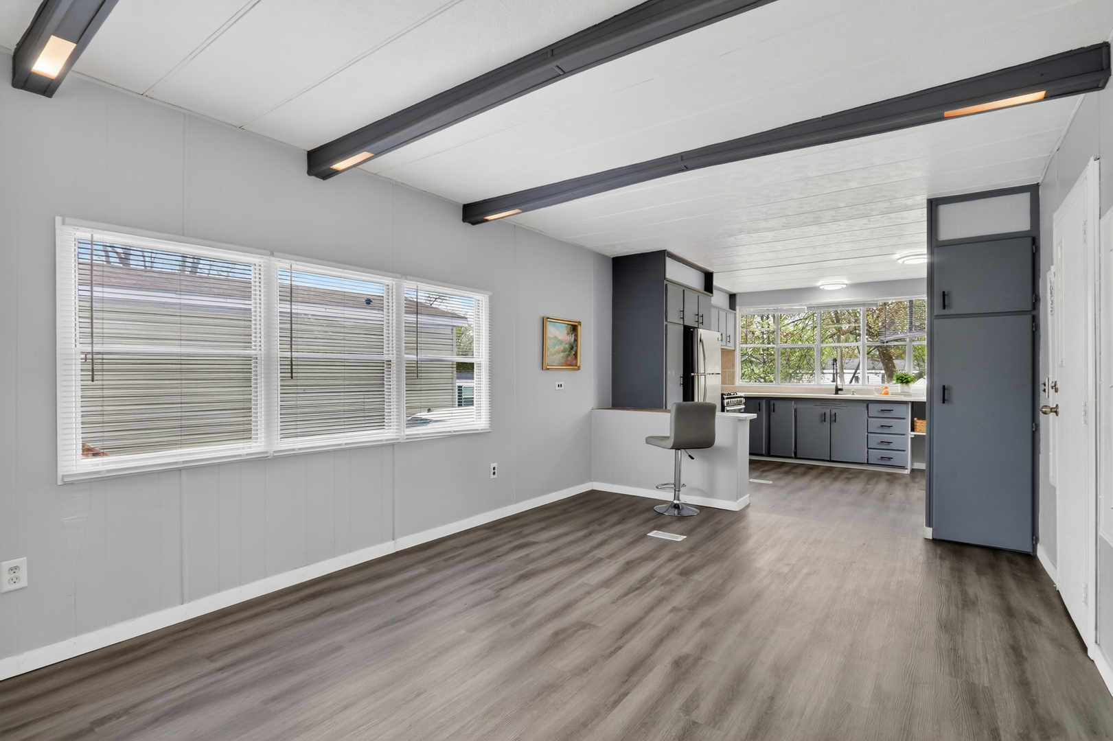 917 Lunga Drive Round Lake, IL 60073 - Photo 4 of 13 a view of an empty room with wooden floor and a window