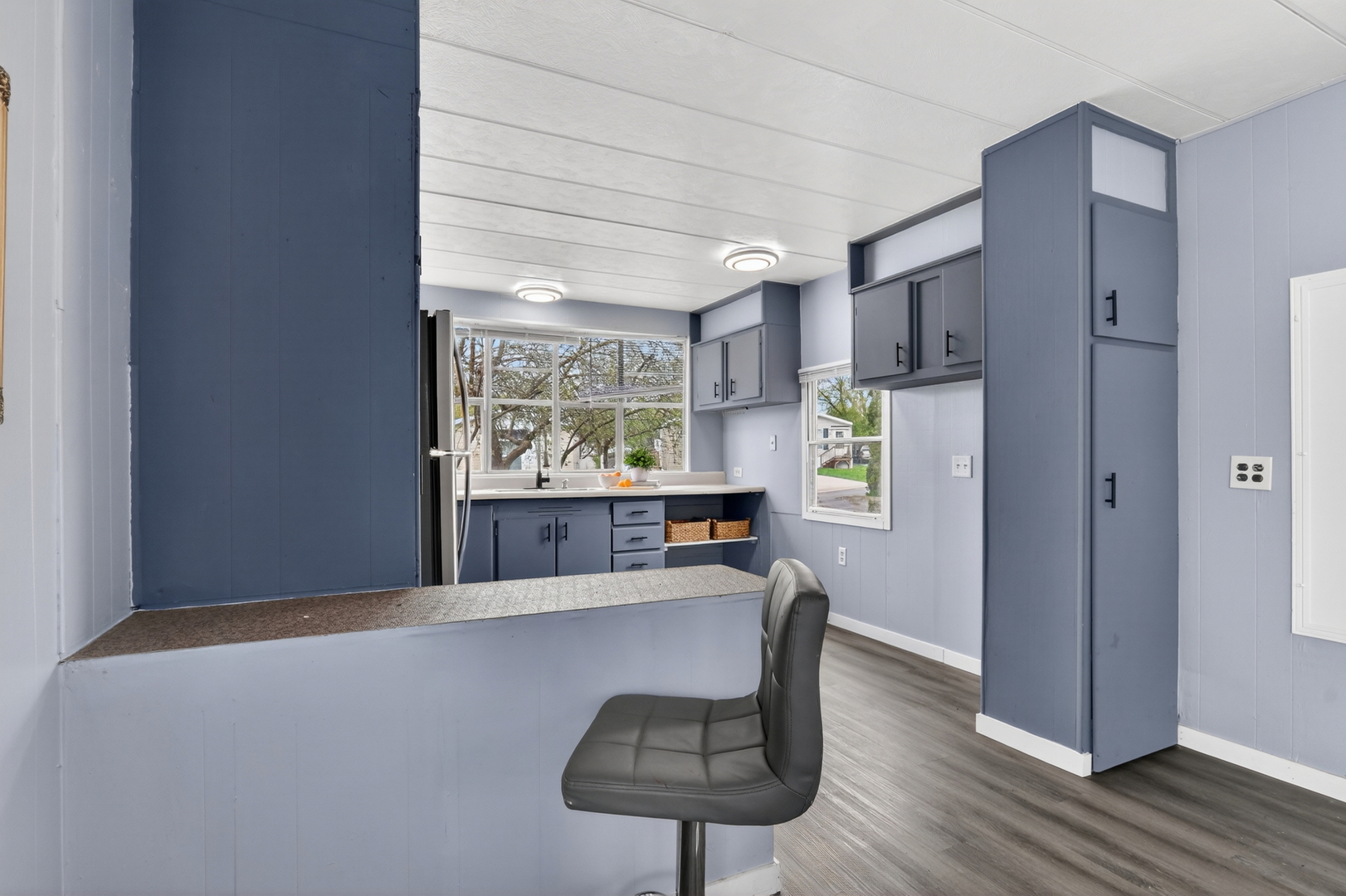 917 Lunga Drive Round Lake, IL 60073 - Photo 5 of 13 a kitchen with a window a refrigerator and wooden floor