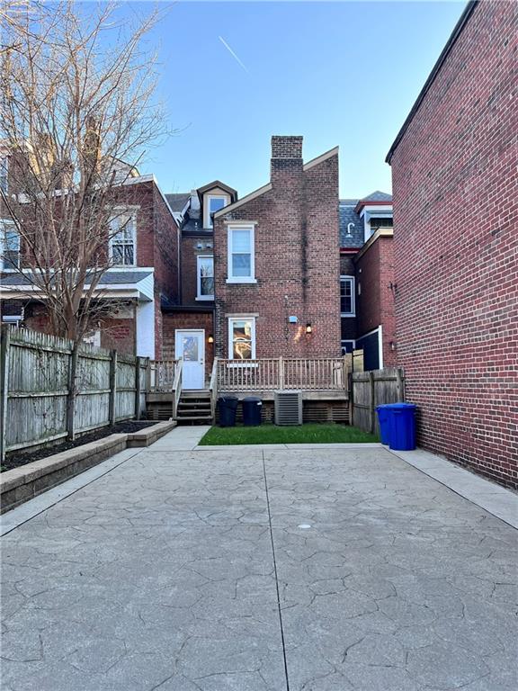 175 45th Street Pittsburgh, PA 15201 - Photo 13 of 13 a view of a brick building next to a yard