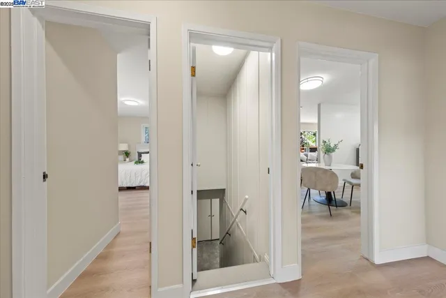a view of a hallway with dining room and closet