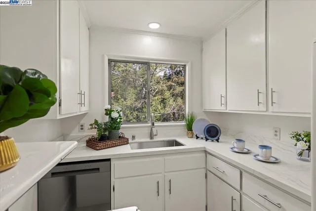 a kitchen with sink and window