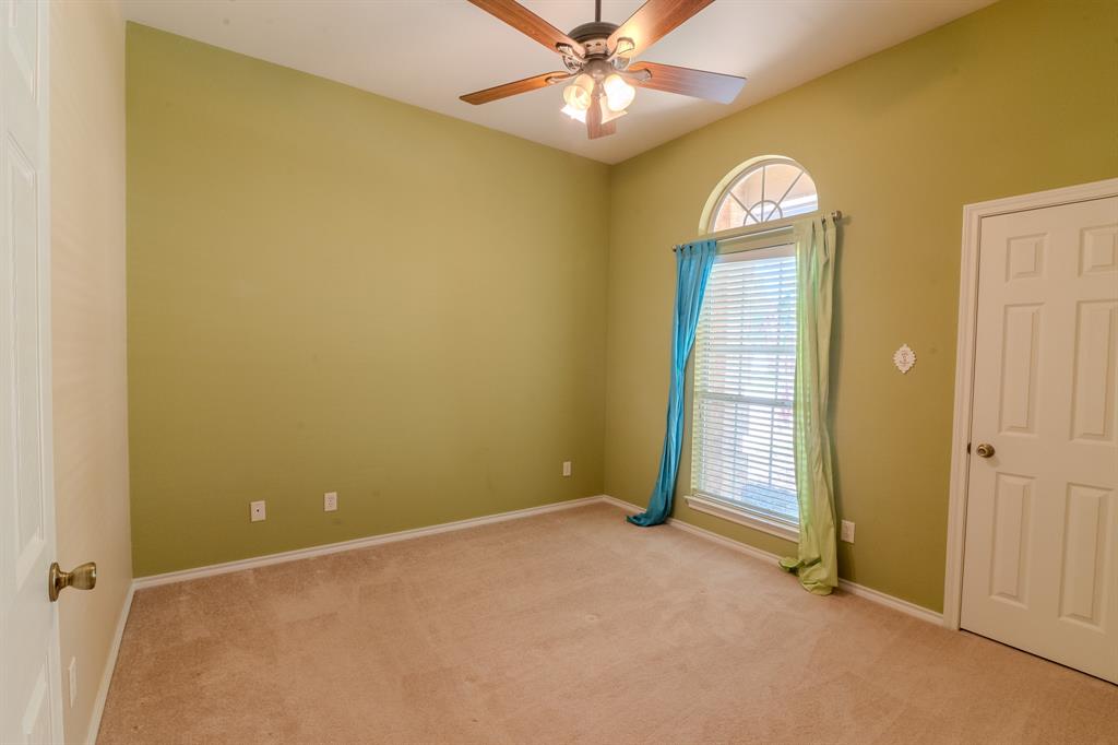 6014 Brenhaven Road Arlington, TX 76017 - Photo 13 of 18 Room featuring a vaulted ceiling and a wood-finish ceiling fan with integrated lighting