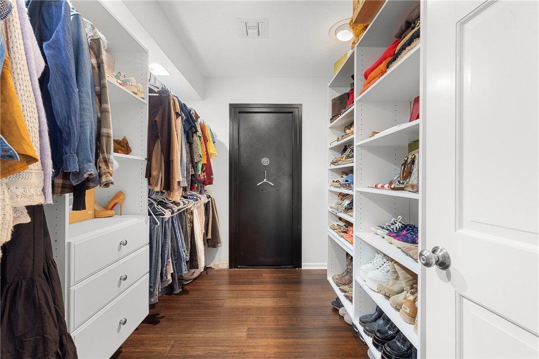 871 Cazey Loop Franklin, TX 77856 - Photo 29 of 42 a view of walk in closet with clothes and shoes
