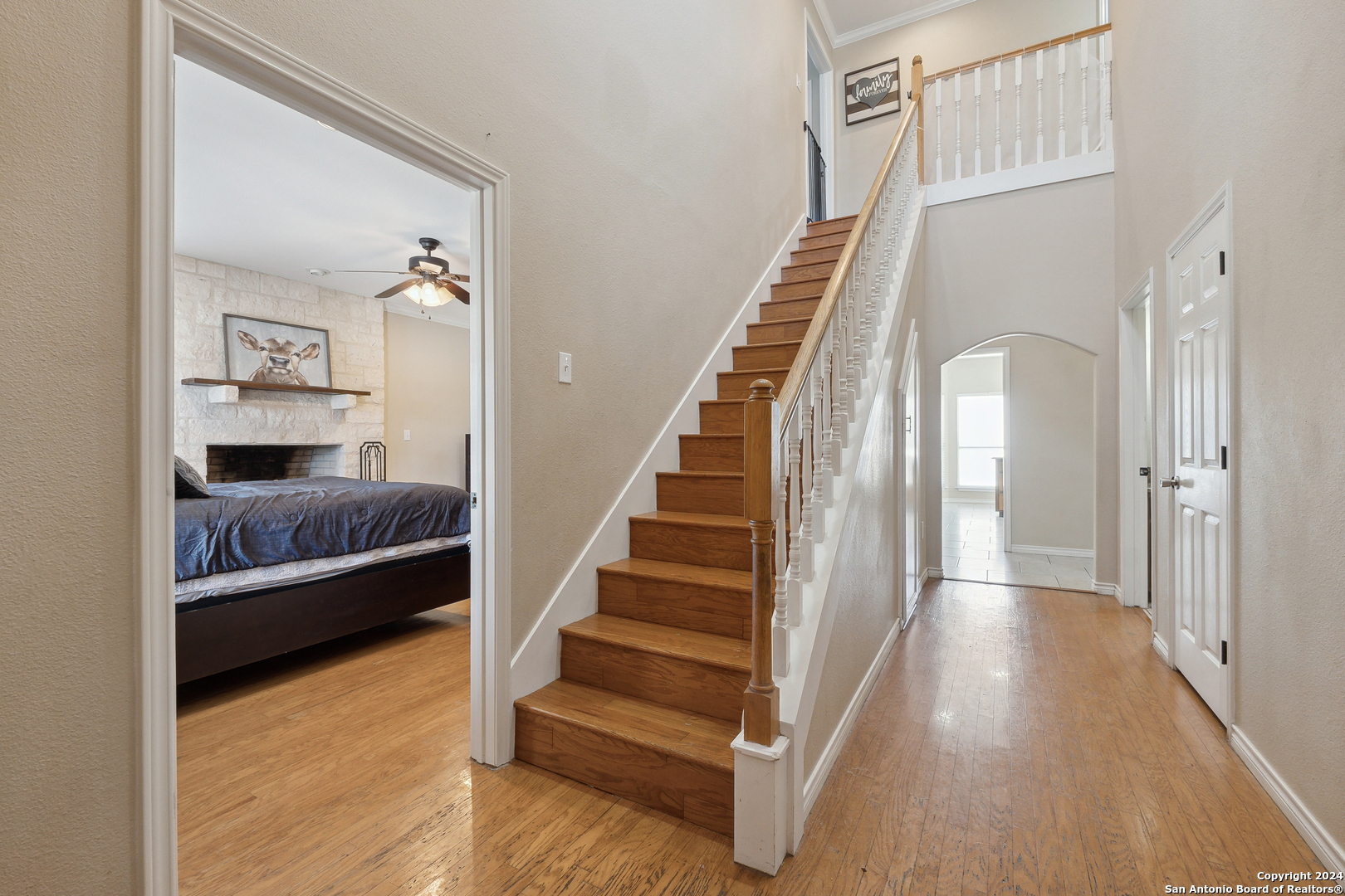 166 Desert Poppy Drive Bandera, TX 78003 - Photo 11 of 50 a view of bedroom and hall with wooden floor