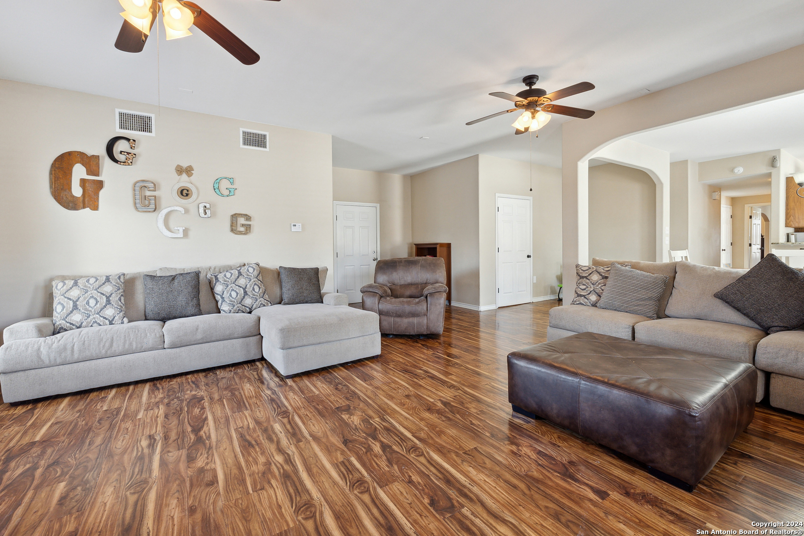 166 Desert Poppy Drive Bandera, TX 78003 - Photo 14 of 50 a living room with furniture and a wooden floor