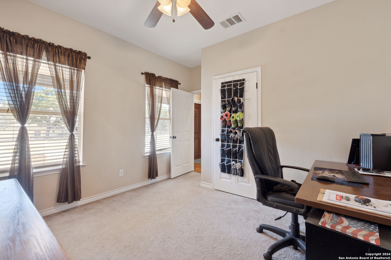 166 Desert Poppy Drive Bandera, TX 78003 - Photo 15 of 50 a view of a workspace with furniture and a window