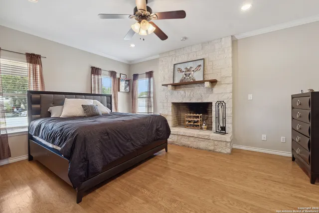 a spacious bedroom with a bed and a fireplace