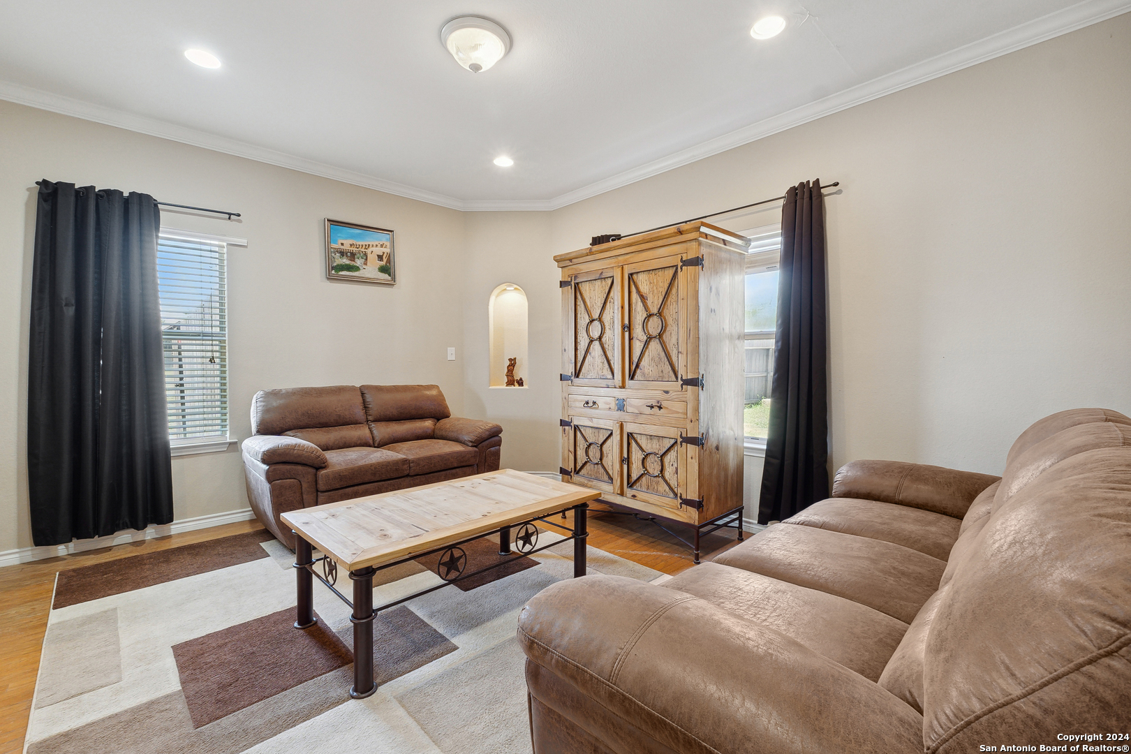 166 Desert Poppy Drive Bandera, TX 78003 - Photo 24 of 50 a living room with furniture a rug and a window