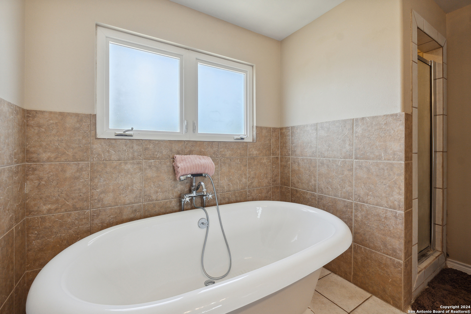 166 Desert Poppy Drive Bandera, TX 78003 - Photo 26 of 50 a white bath tub sitting in a bathroom