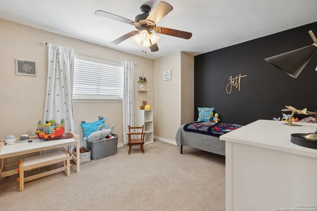 a bedroom with furniture and white walls