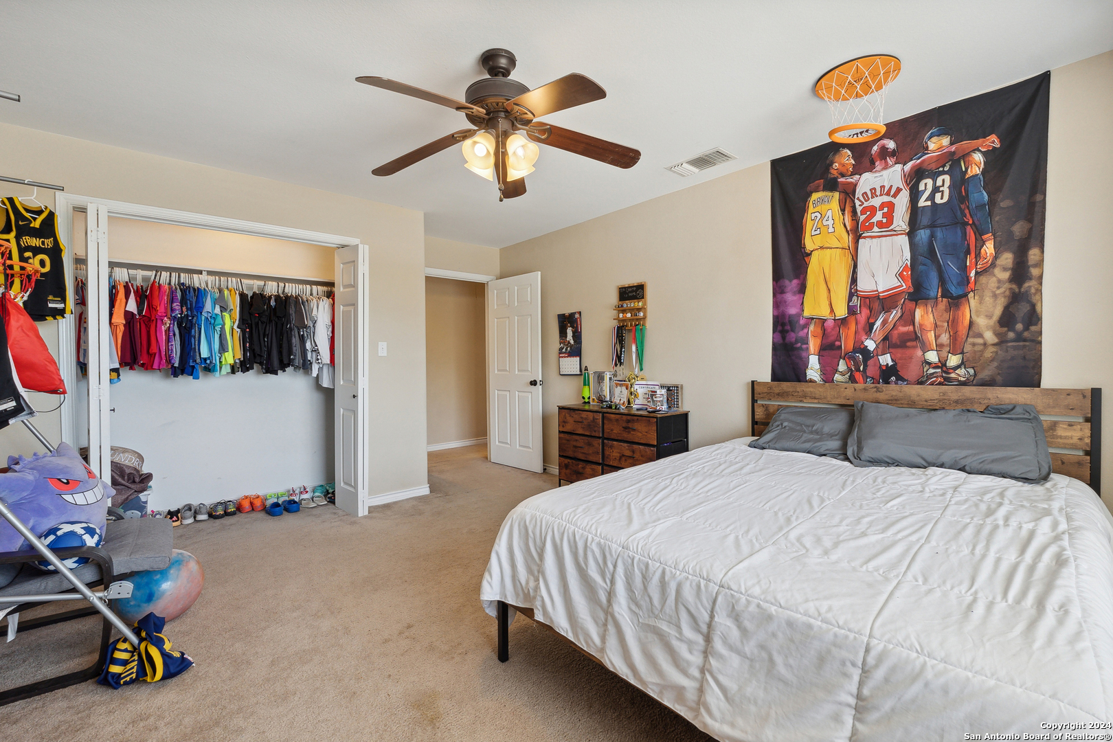 166 Desert Poppy Drive Bandera, TX 78003 - Photo 34 of 50 a bedroom with a bed dresser and furniture