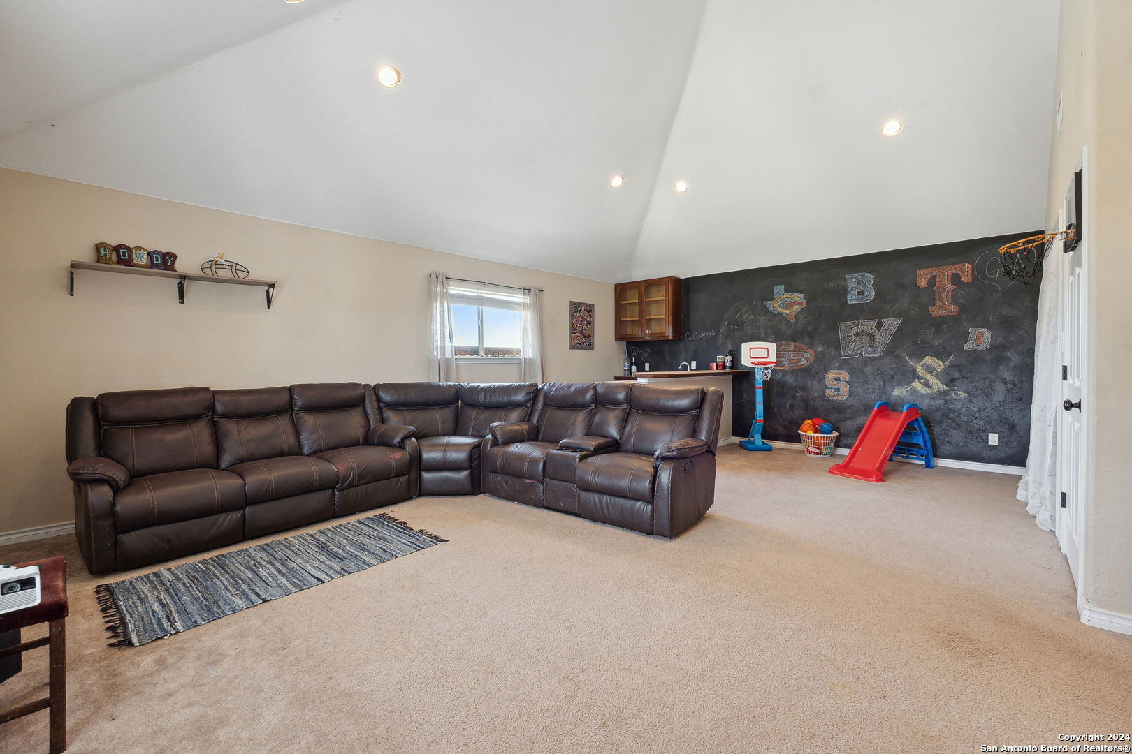 166 Desert Poppy Drive Bandera, TX 78003 - Photo 36 of 50 a living room with furniture and a flat screen tv