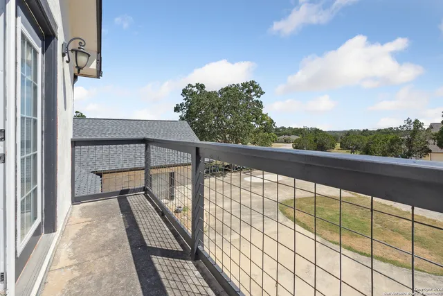 a view of balcony with wooden floor