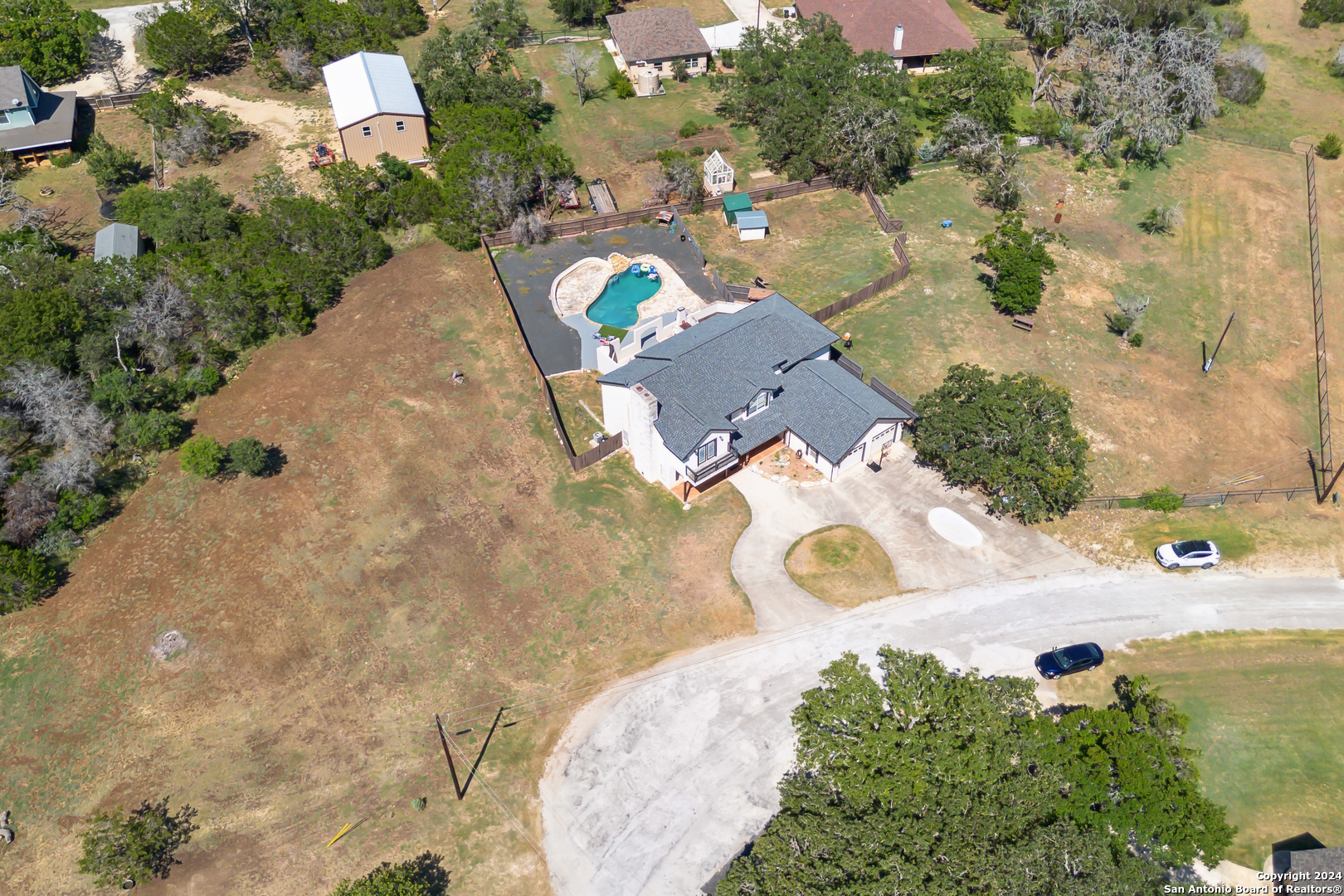166 Desert Poppy Drive Bandera, TX 78003 - Photo 43 of 50 an aerial view of a house with a yard