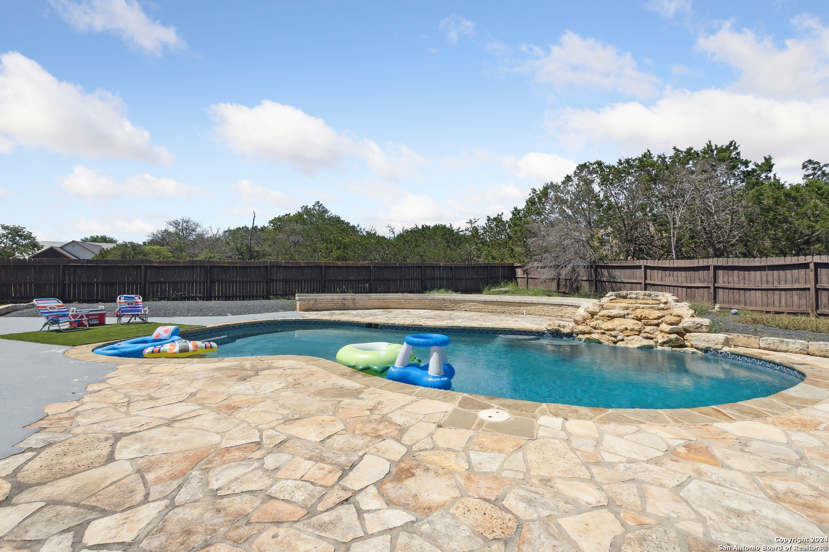 166 Desert Poppy Drive Bandera, TX 78003 - Photo 6 of 50 a view of swimming pool with seating space