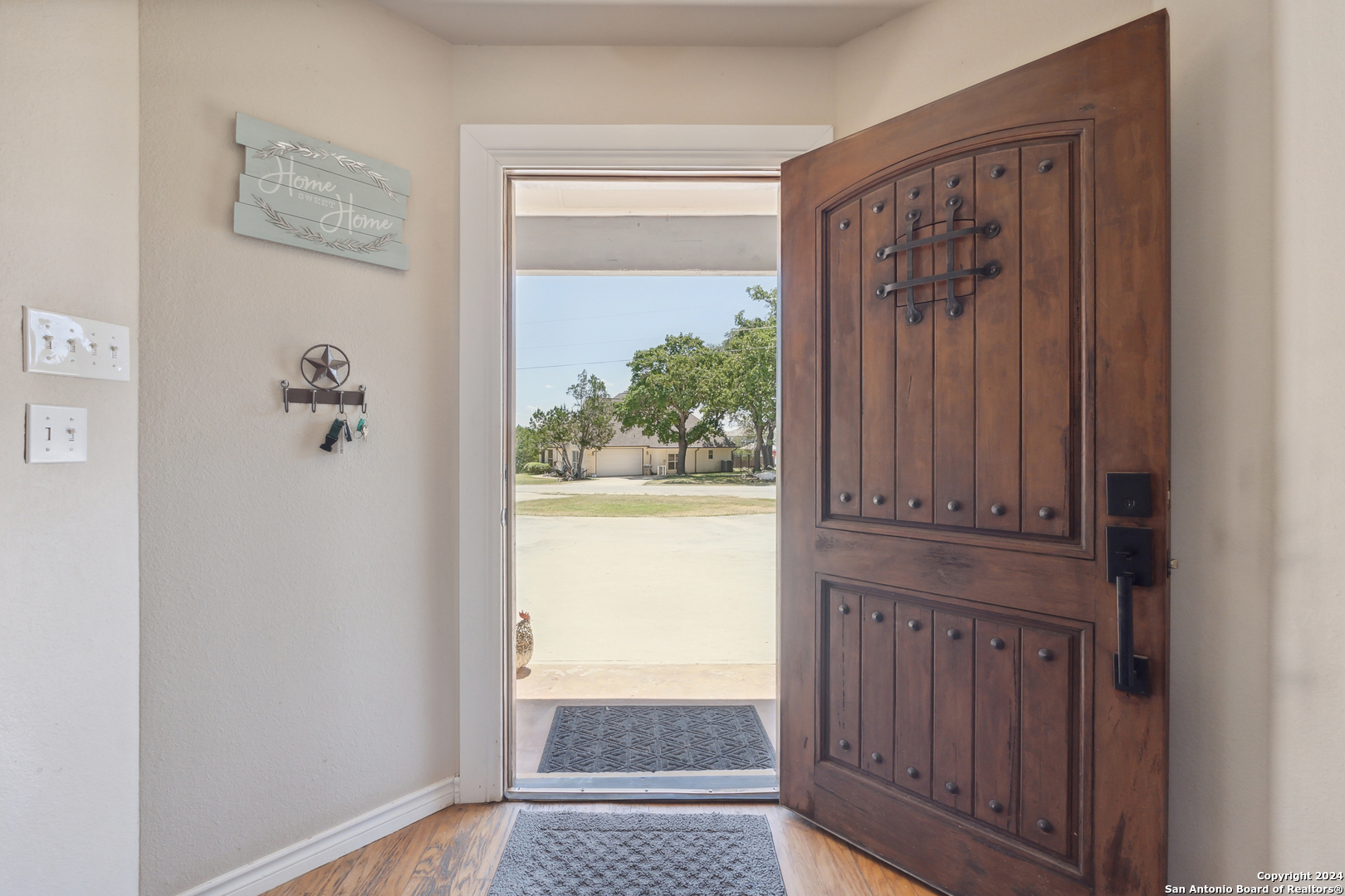 166 Desert Poppy Drive Bandera, TX 78003 - Photo 10 of 50 a view of front door with wooden floor