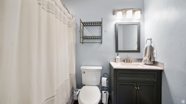 141 East 550 North Springville, UT 84663 - Photo 13 of 28 Bathroom featuring a dark vanity with a light-toned countertop