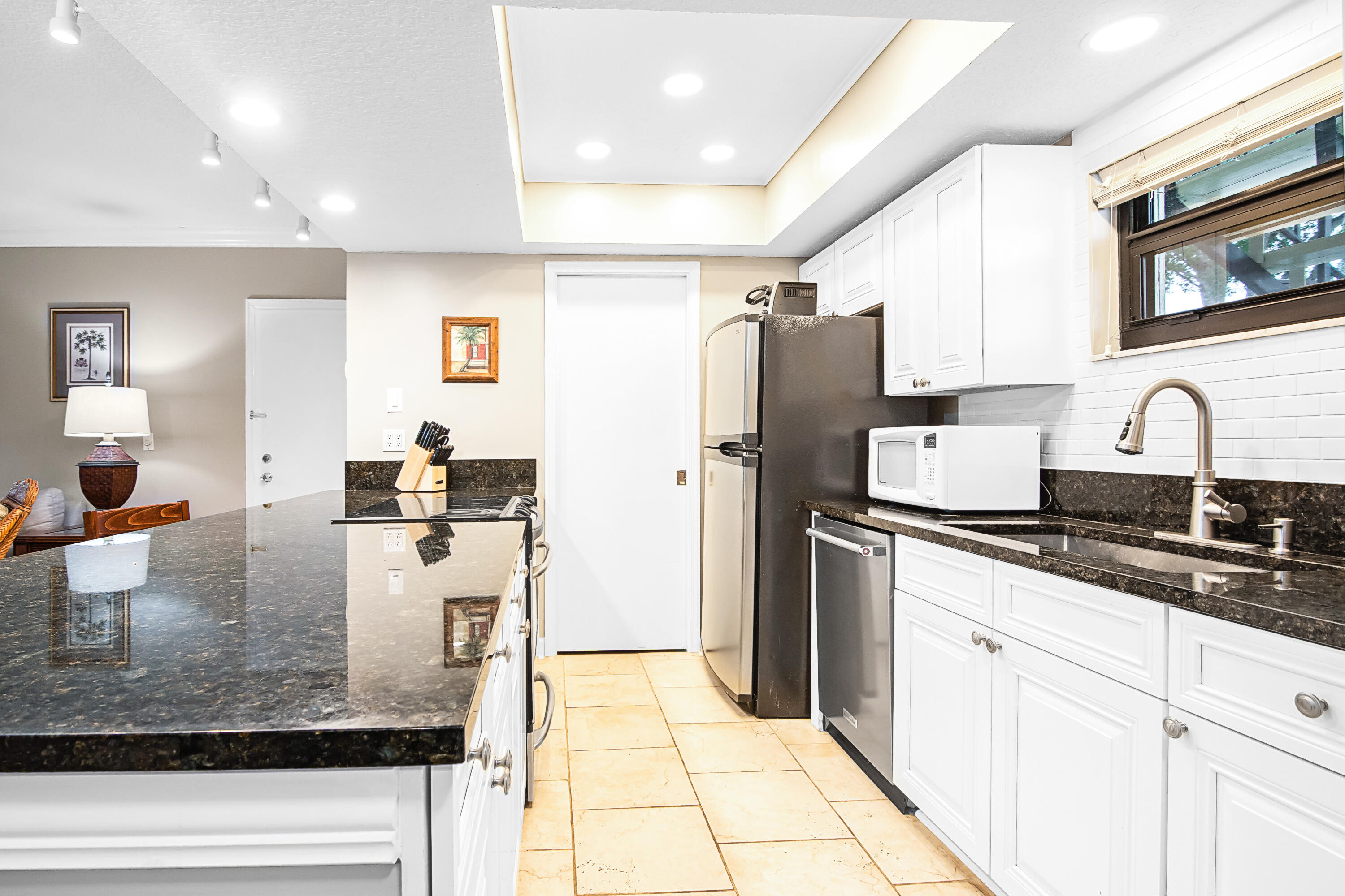 13334 Polo Club Road, Unit 218 Wellington, FL 33414 - Photo 3 of 13 a kitchen with refrigerator and stove