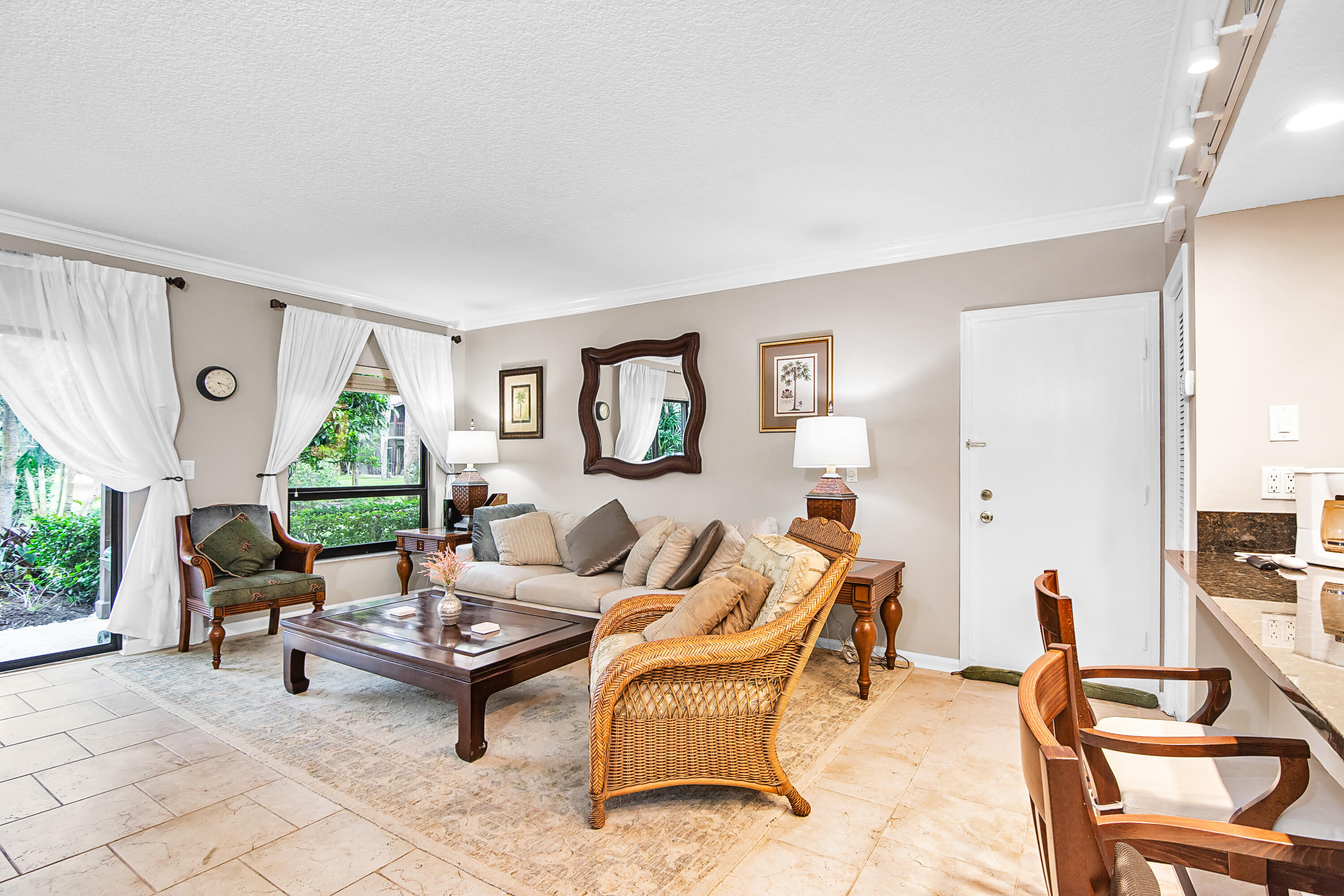 13334 Polo Club Road, Unit 218 Wellington, FL 33414 - Photo 5 of 13 a living room with furniture and a large window