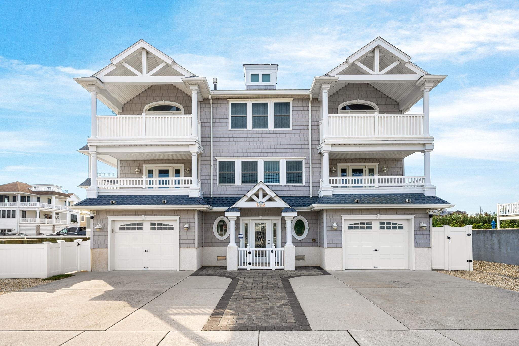 a big white building with a clock on the top