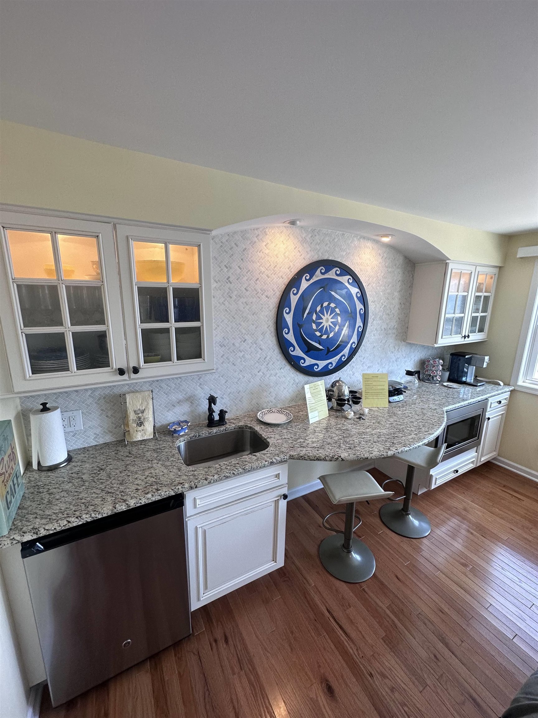 704 South Commonwealth Avenue Strathmere, NJ 08248 - Photo 11 of 50 a kitchen with granite countertop a sink a stove and a wooden floors