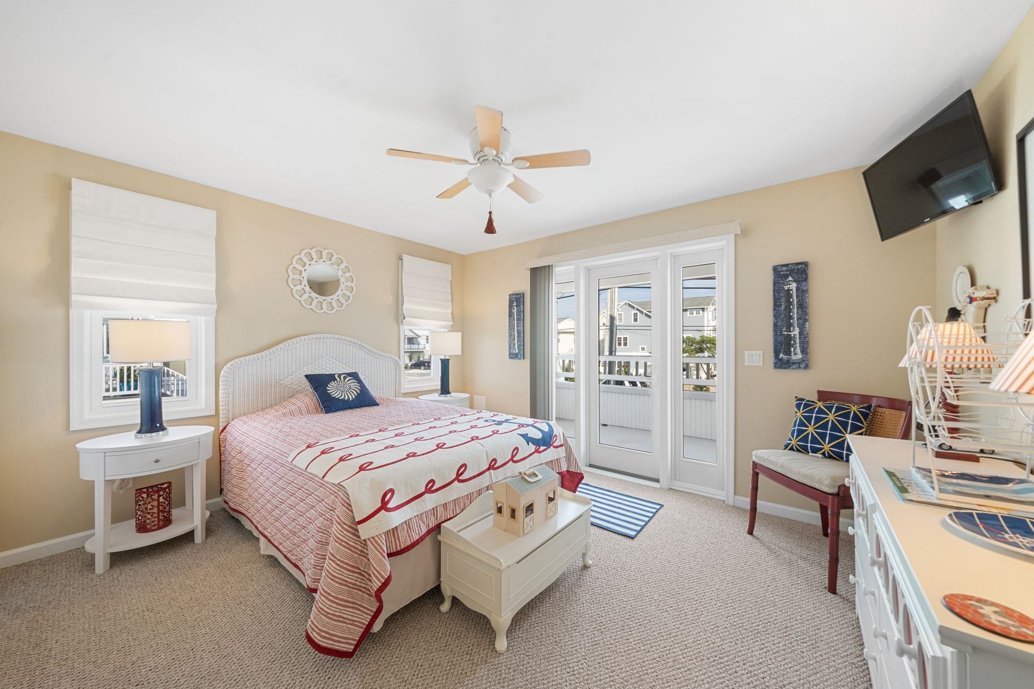 704 South Commonwealth Avenue Strathmere, NJ 08248 - Photo 14 of 50 a bedroom with a bed a couch and dresser