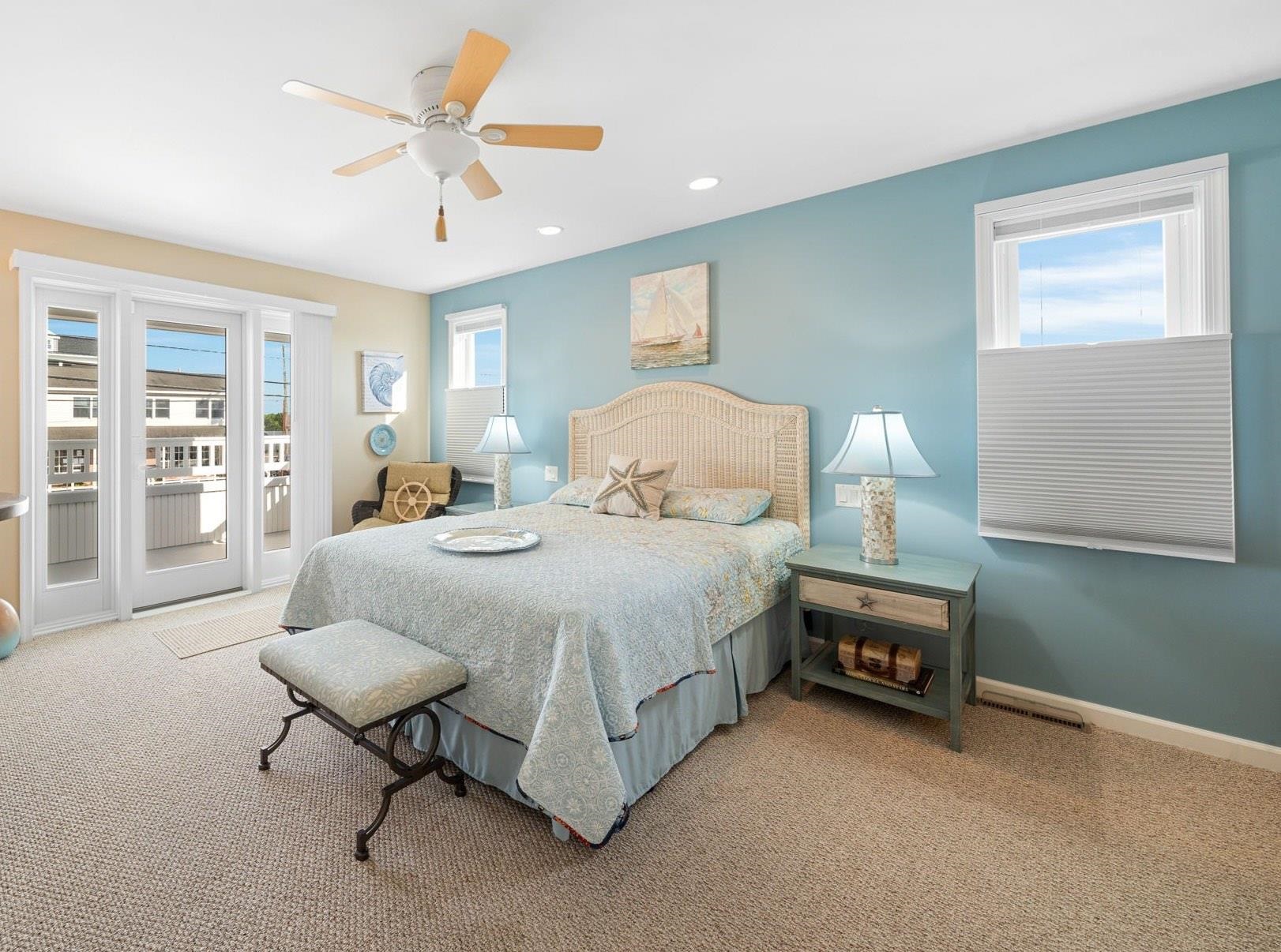 704 South Commonwealth Avenue Strathmere, NJ 08248 - Photo 18 of 50 a bedroom with a bed a table and painting