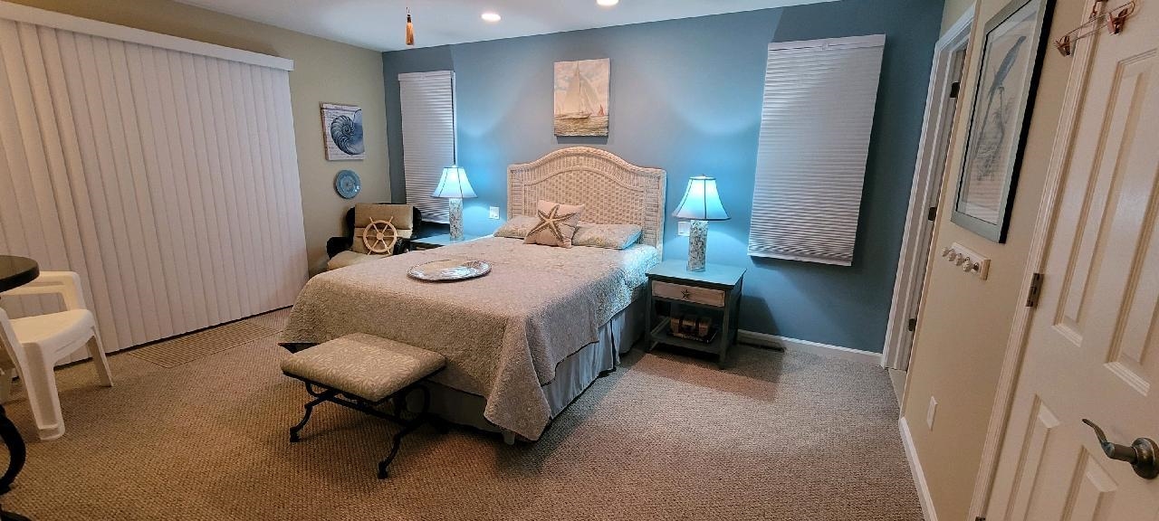 704 South Commonwealth Avenue Strathmere, NJ 08248 - Photo 19 of 50 a bedroom with a bed and a window