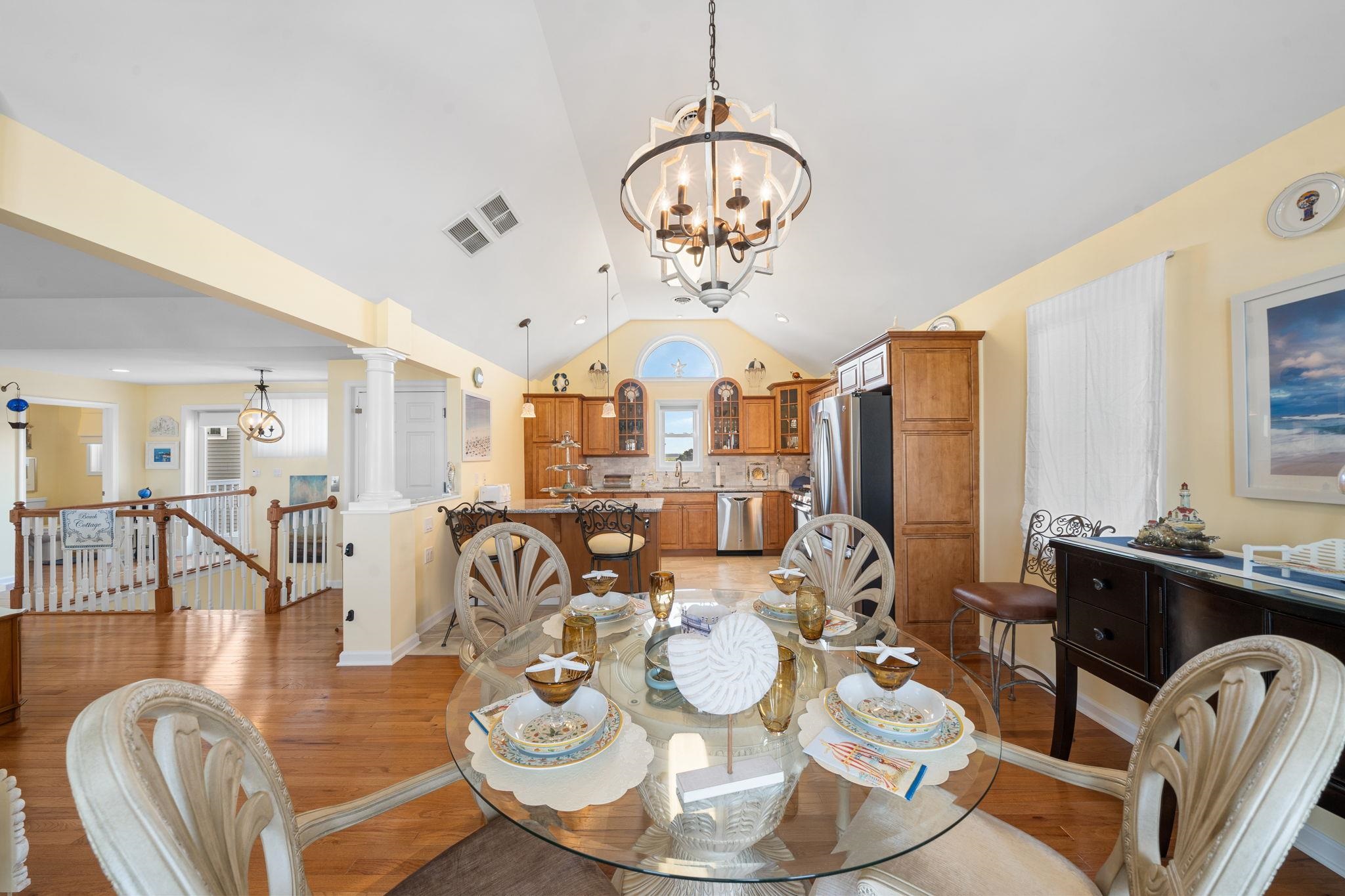 704 South Commonwealth Avenue Strathmere, NJ 08248 - Photo 30 of 50 a very nice looking dining room with furniture a chandelier and wooden floor