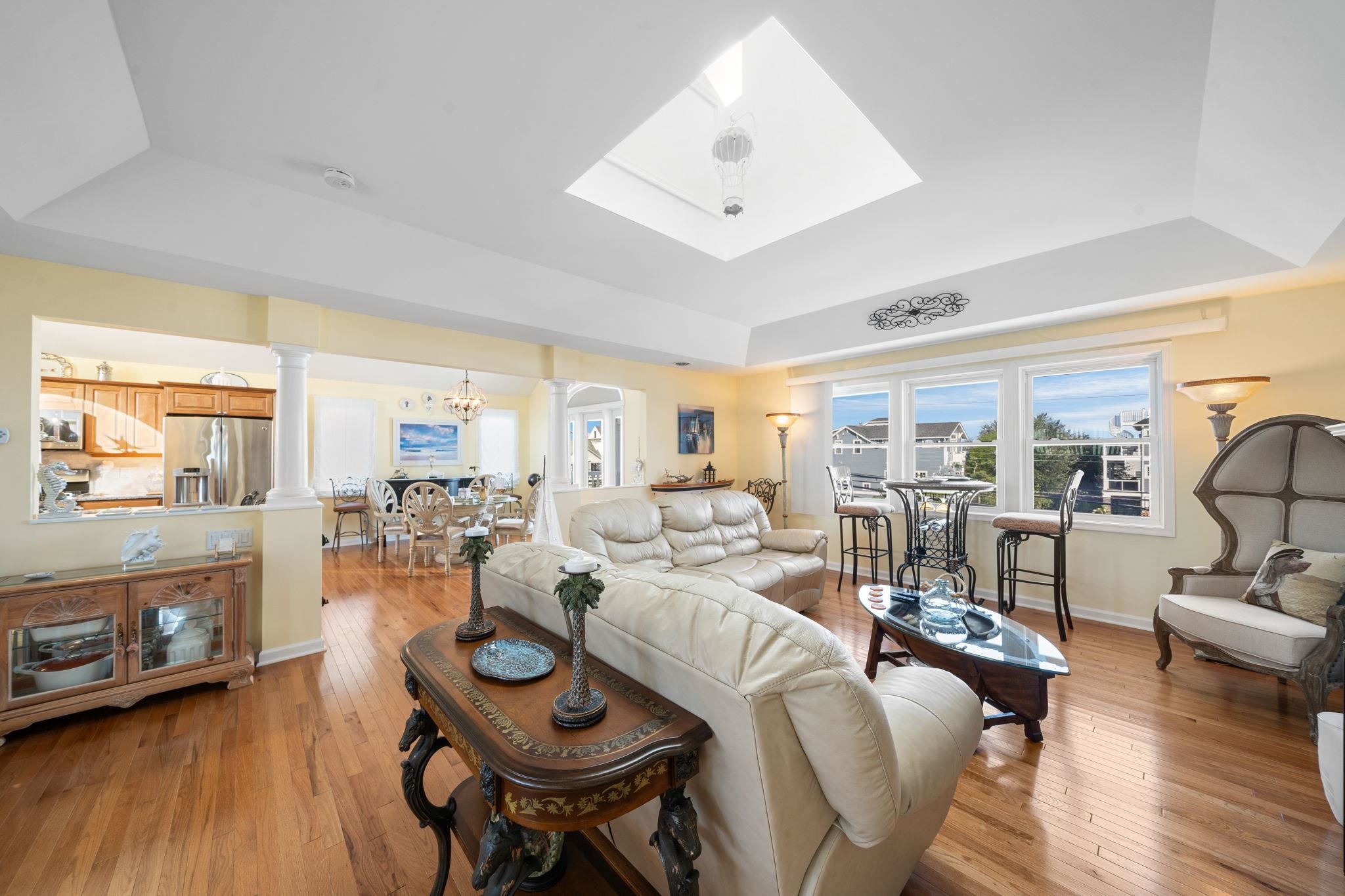 704 South Commonwealth Avenue Strathmere, NJ 08248 - Photo 33 of 50 a living room with furniture and a fireplace