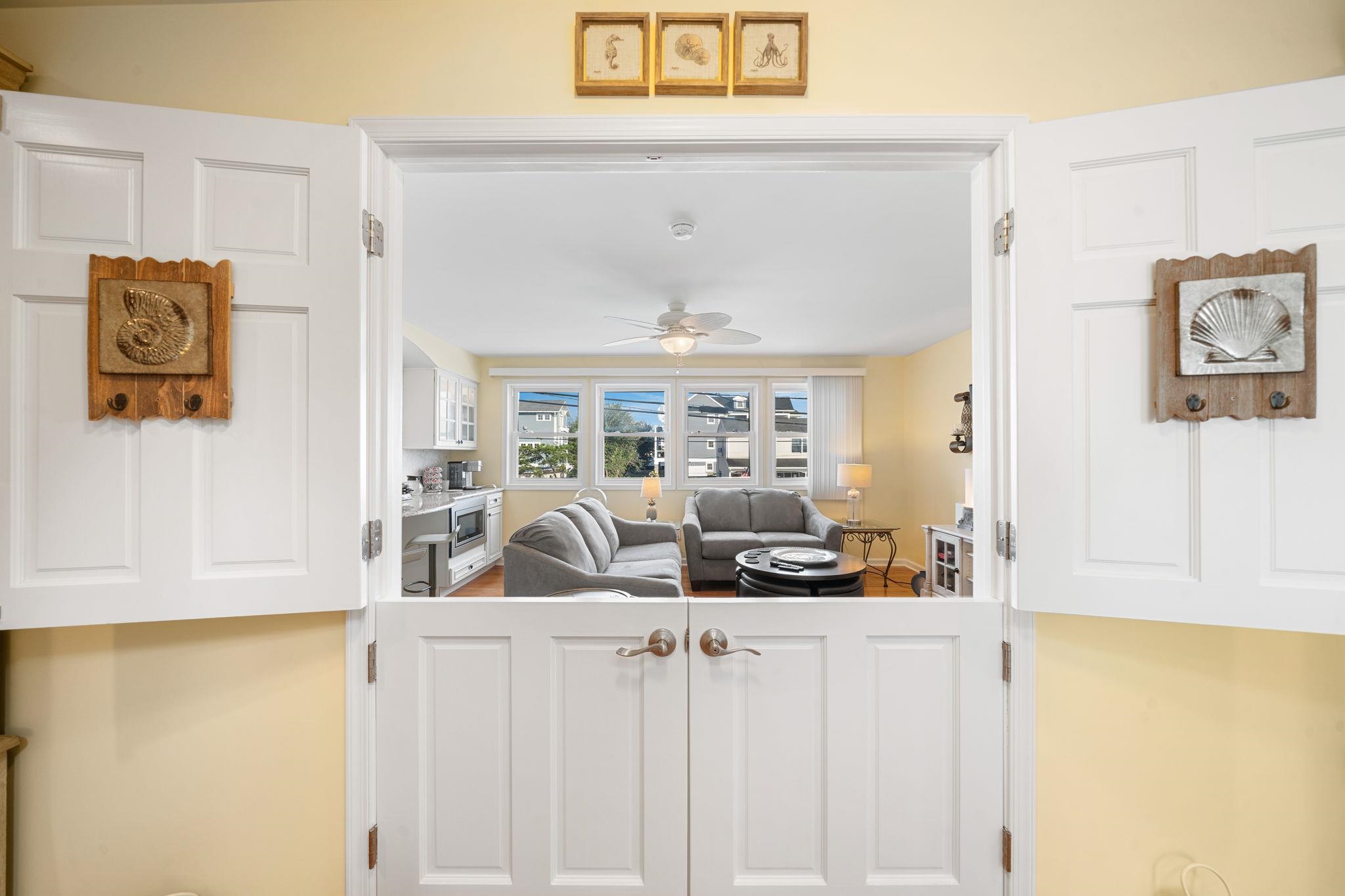 704 South Commonwealth Avenue Strathmere, NJ 08248 - Photo 8 of 50 a living room with furniture and a table