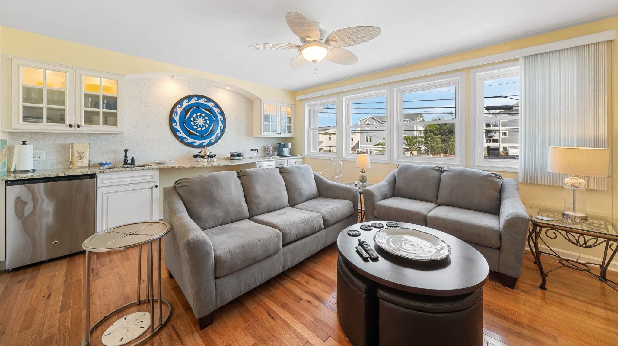 704 South Commonwealth Avenue Strathmere, NJ 08248 - Photo 10 of 50 a living room with furniture a rug and a window