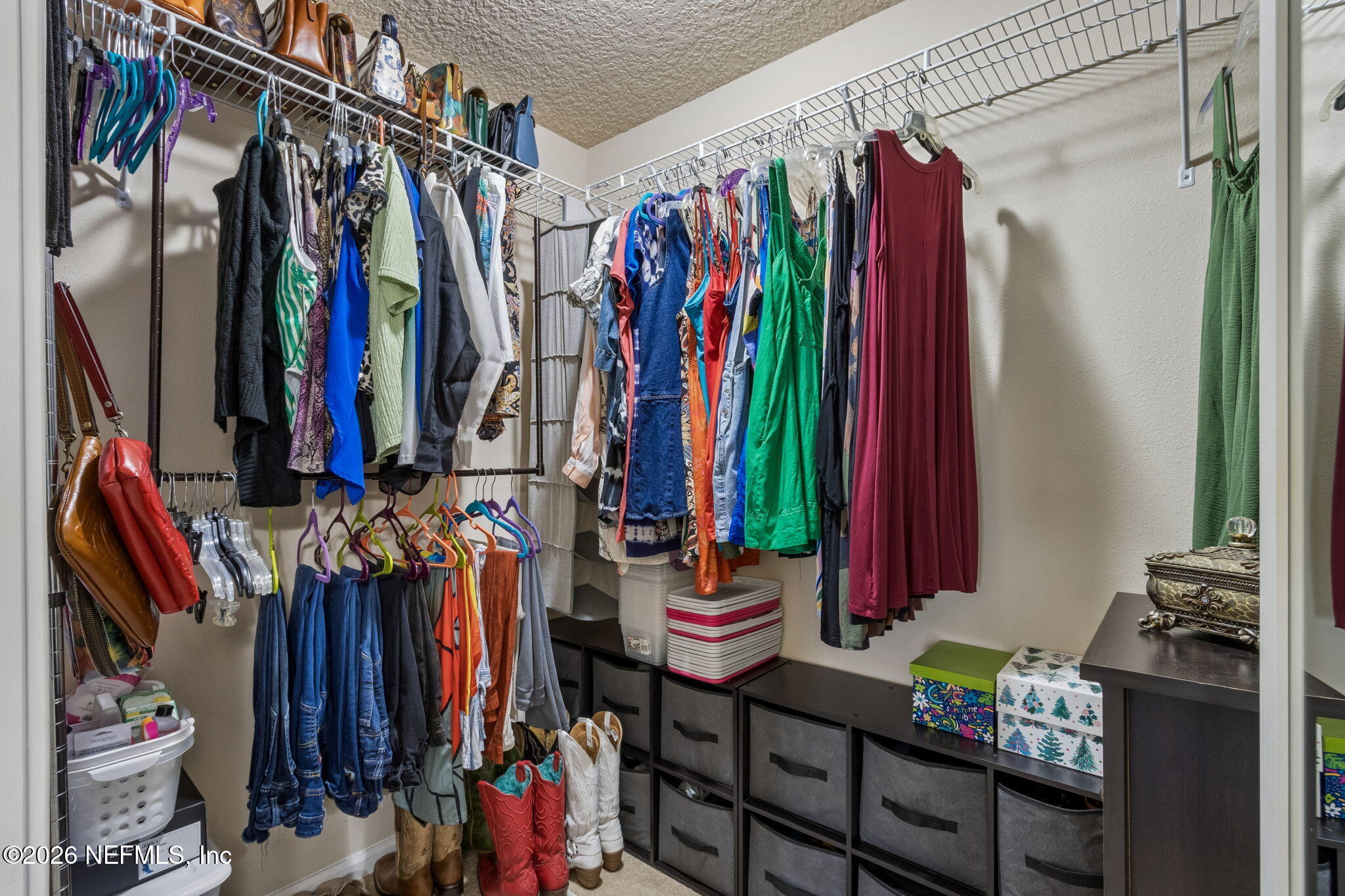 96034 Bass Lane Yulee, FL 32097 - Photo 33 of 50 a view of walk in closet with clothes