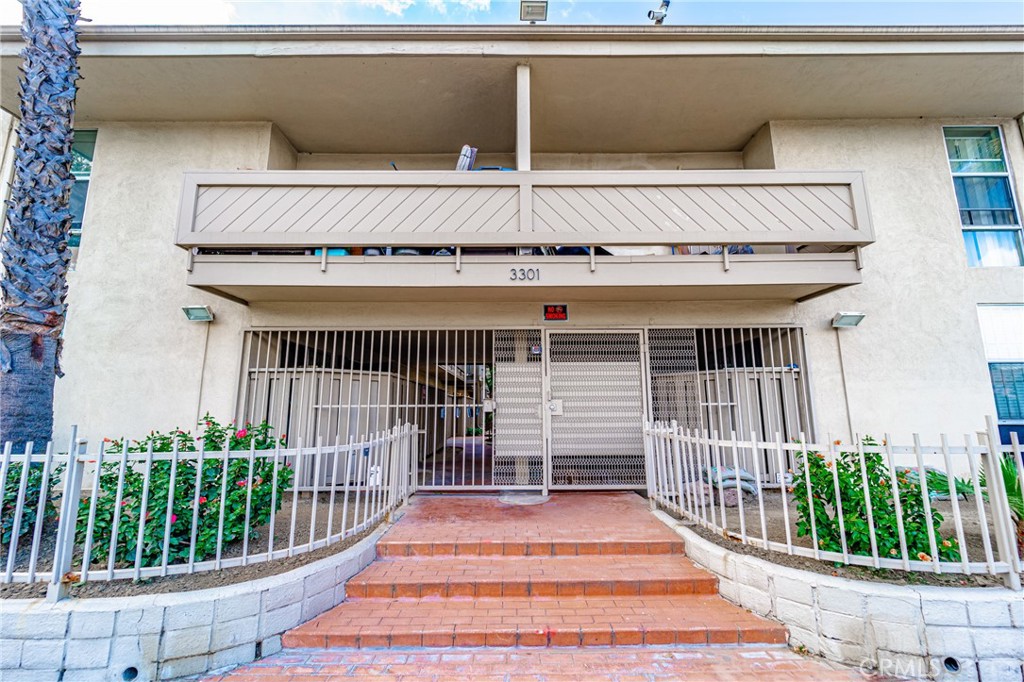 3301 Santa Fe Avenue, Unit 49 Long Beach, CA 90810 - Photo 1 of 1 a view of entryway with wooden floor