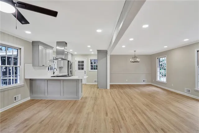a view of kitchen with sink and window