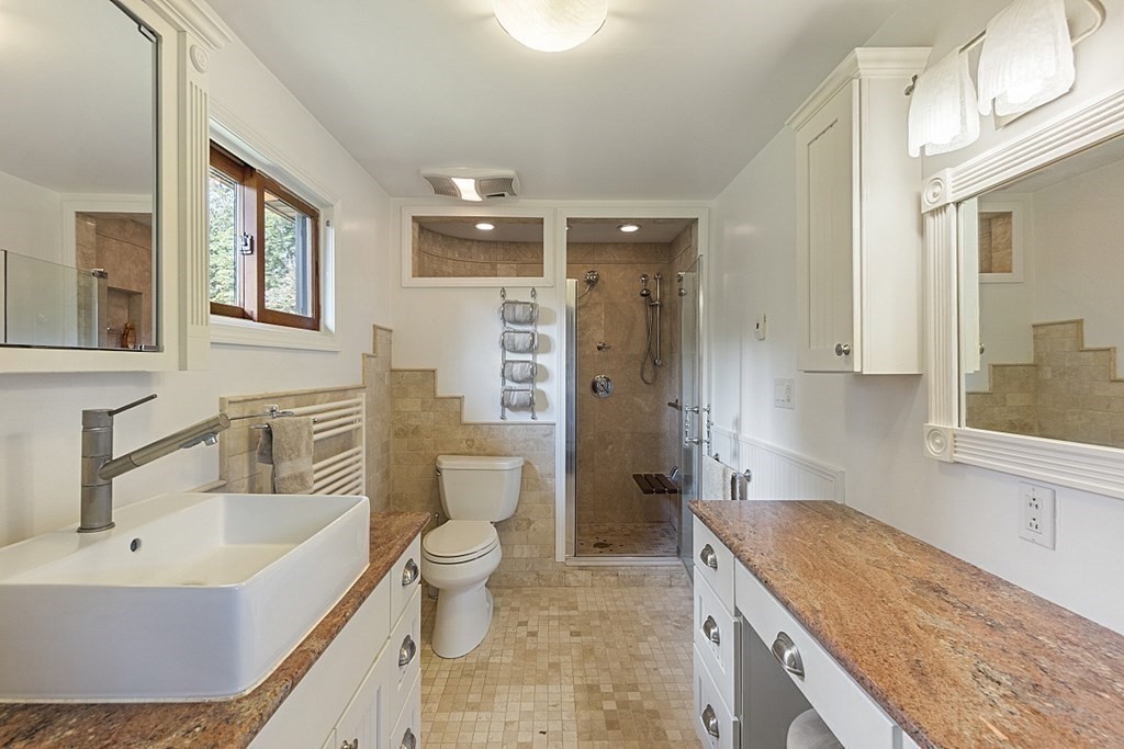 190 Davis Road Westminster, MA 01473 - Photo 26 of 41 a bathroom with a granite countertop sink mirror vanity and toilet