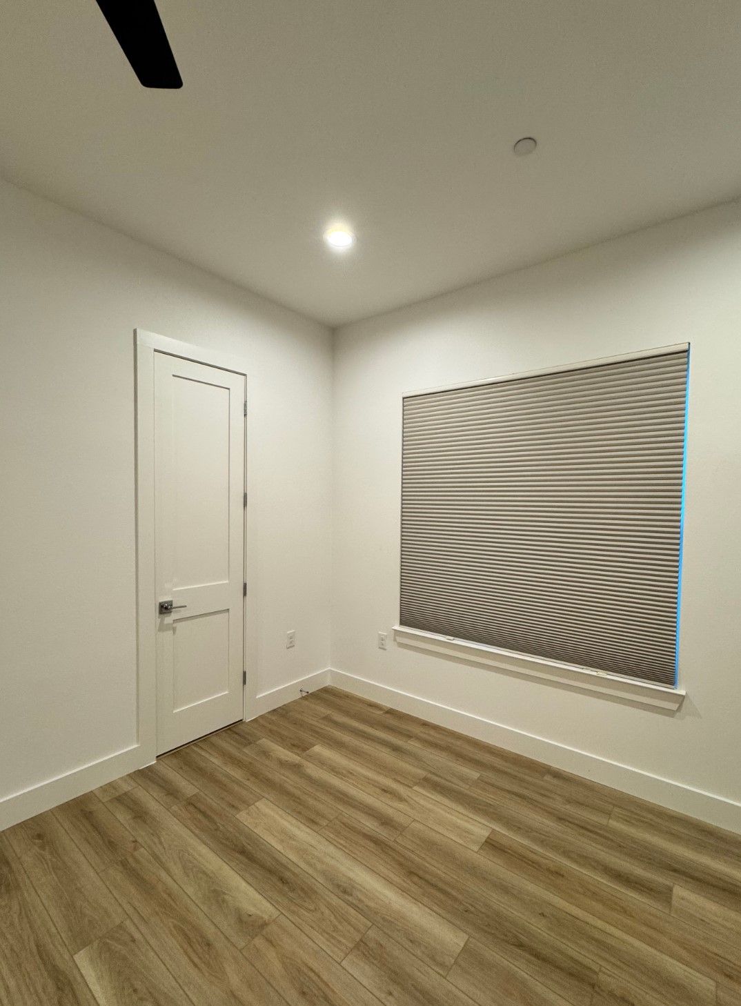 590 Old Mill Road, Unit 210 Cedar Park, TX 78613 - Photo 4 of 4 Empty room featuring wood finished floors and a ceiling fan