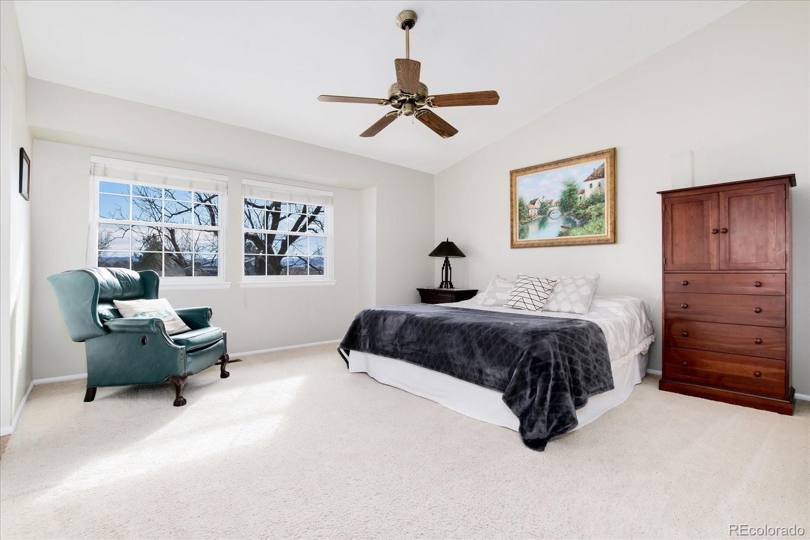 405 Northridge Road Highlands Ranch, CO 80126 - Photo 18 of 40 a bedroom with a bed couch and window