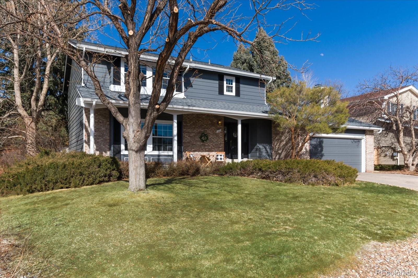 405 Northridge Road Highlands Ranch, CO 80126 - Photo 2 of 40 a front view of a house with a yard