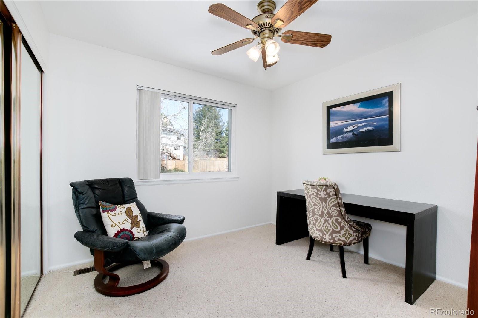 405 Northridge Road Highlands Ranch, CO 80126 - Photo 24 of 40 a living room with furniture and a large window