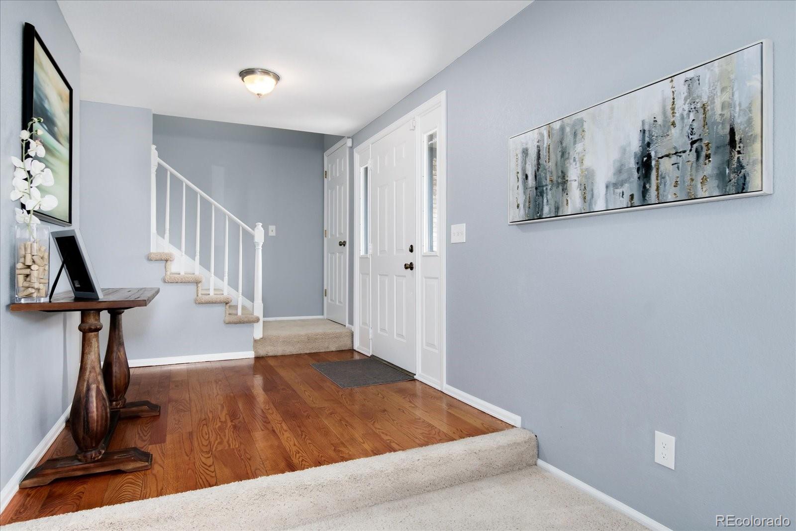 405 Northridge Road Highlands Ranch, CO 80126 - Photo 3 of 40 a view of an entryway with wooden floor