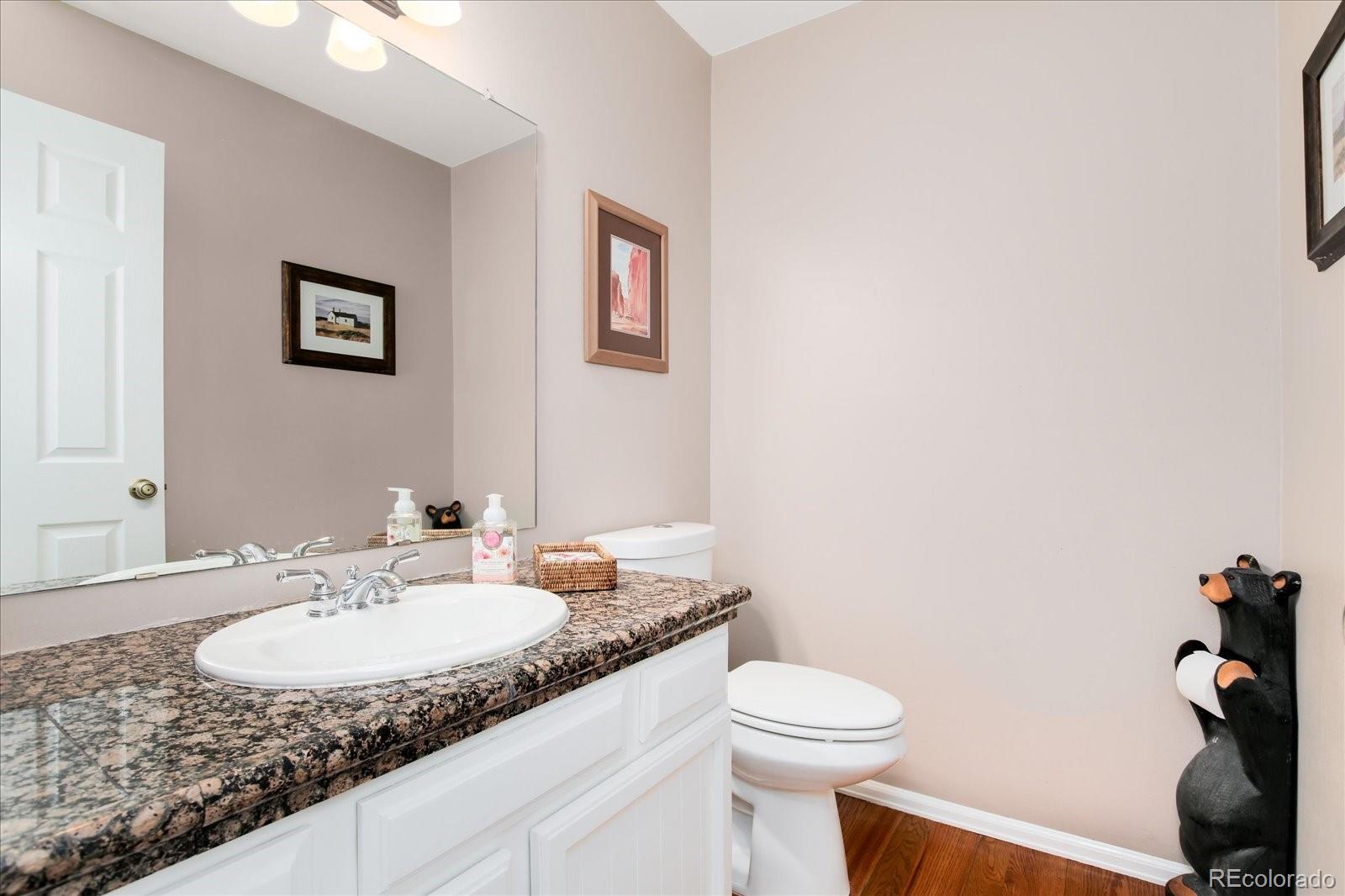 405 Northridge Road Highlands Ranch, CO 80126 - Photo 31 of 40 a bathroom with a granite countertop sink and a mirror