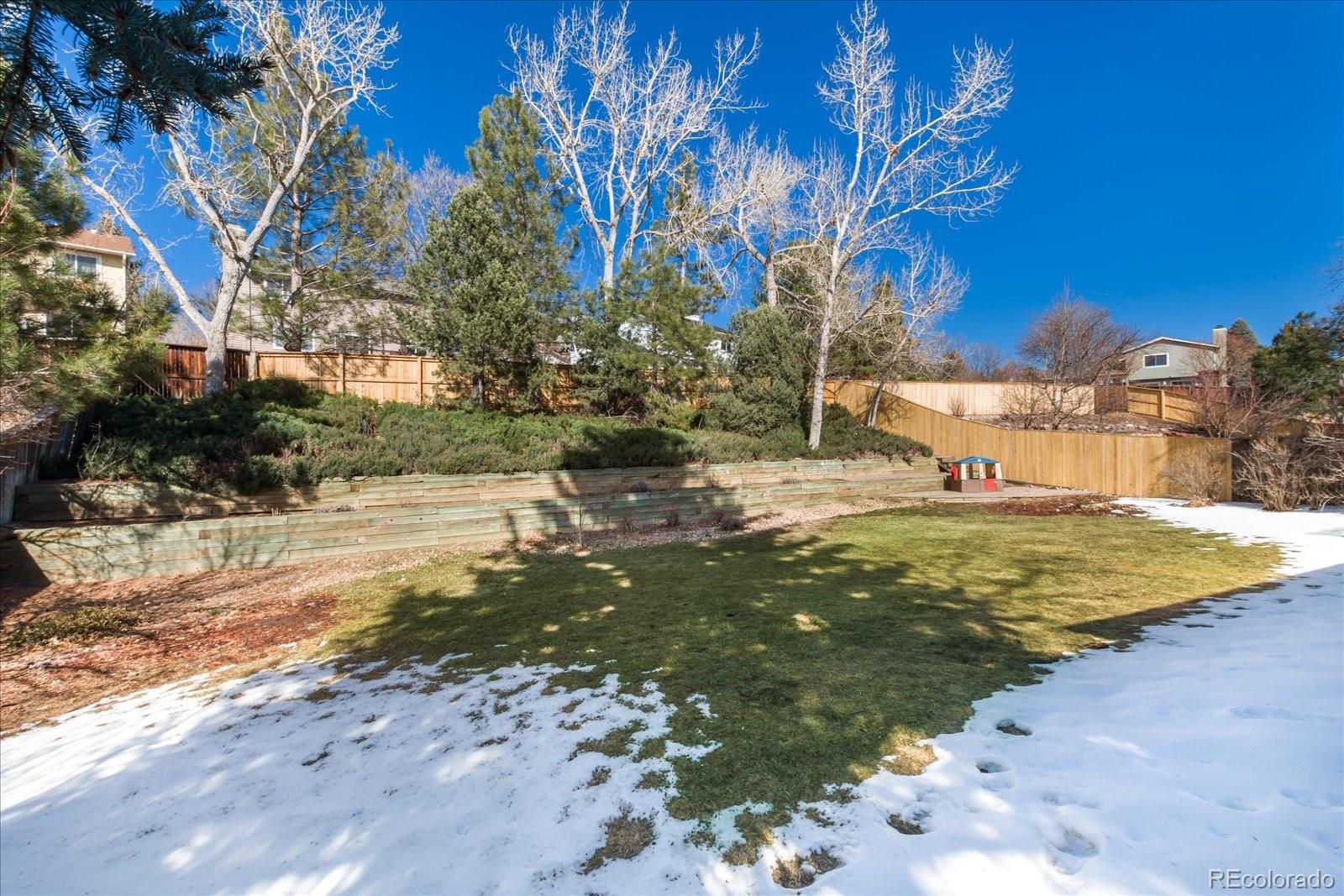 405 Northridge Road Highlands Ranch, CO 80126 - Photo 36 of 40 a view of a yard with large trees