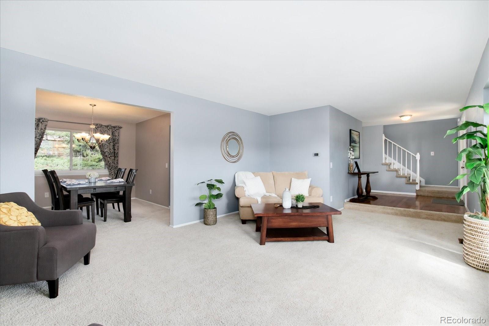 405 Northridge Road Highlands Ranch, CO 80126 - Photo 5 of 40 a living room with furniture and a window