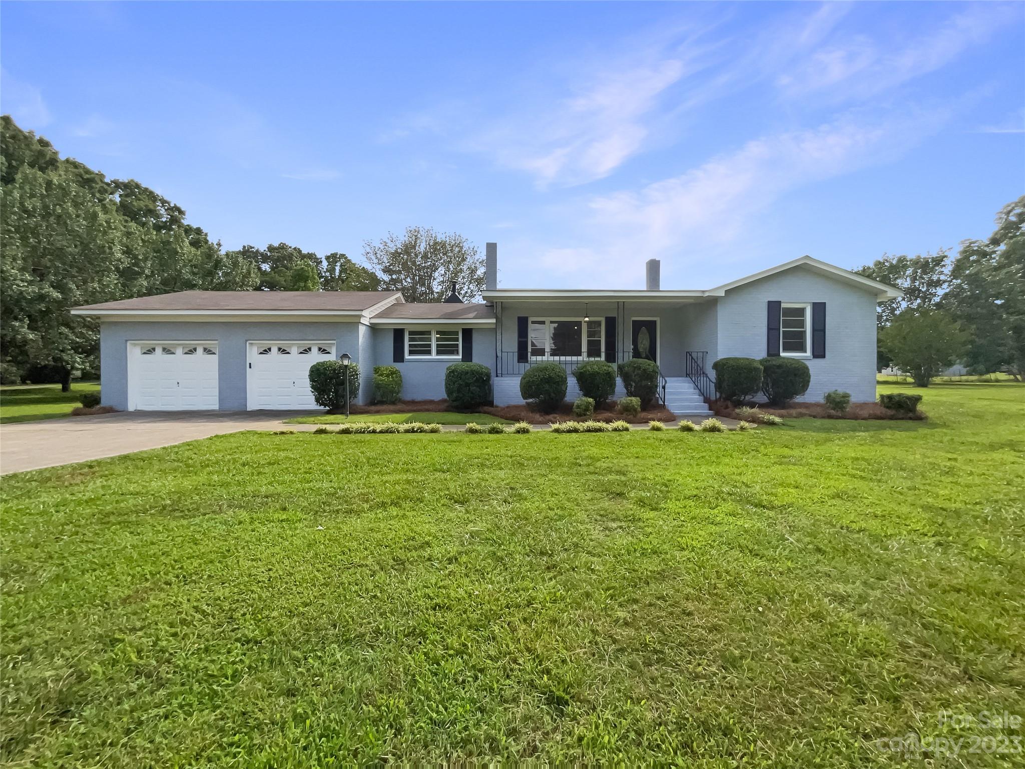 4719 Pleasant Grove Road Waxhaw, NC 28173 - Photo 1 of 24 a view of a house with a big yard